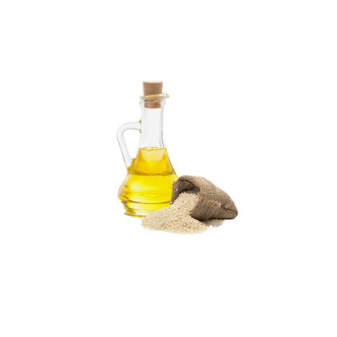 Bottle of organic expeller pressed sesame oil with golden color on a white background