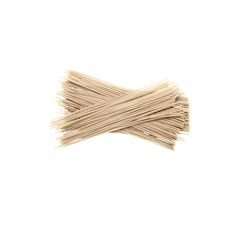 Organic soba pasta made with buckwheat and spring wheat in a basket on a white background