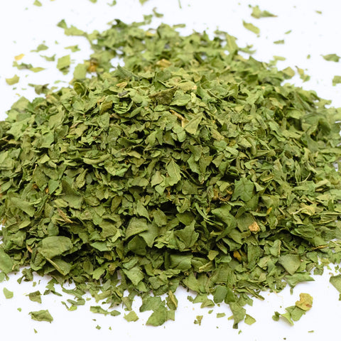 Pile of organic spinach flakes