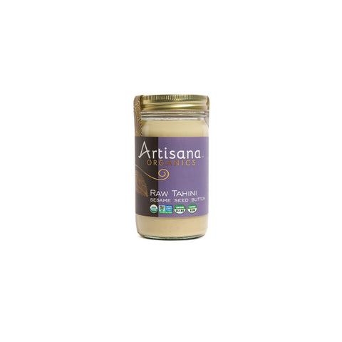Jar of organic raw sesame tahini with smooth, creamy texture on a white background