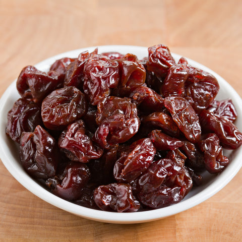 Bowl of organic tart cherries pitted