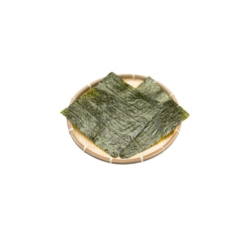 Organic toasted nori seaweed sheets on a white background