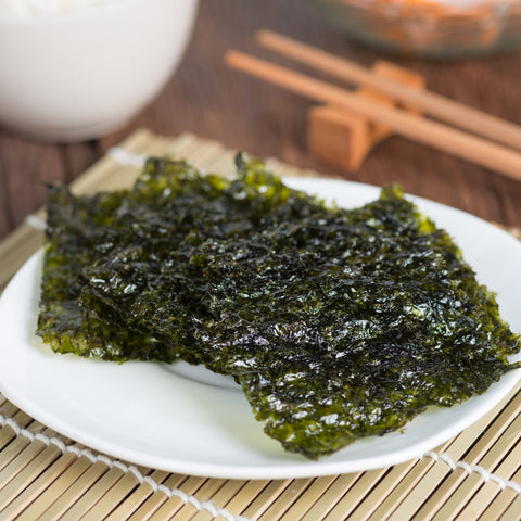 Organic toasted nori seaweed sheets on a plate
