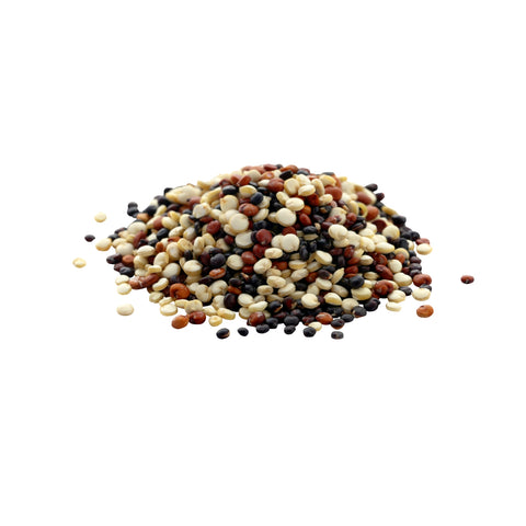 Mix of organic white, red, and black quinoa grains on a white background