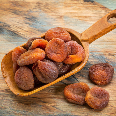 Scoop of organic turkish apricots