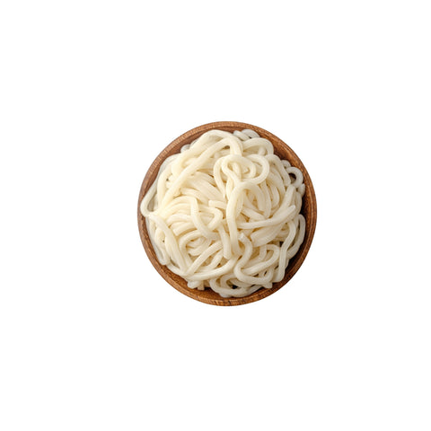 Wooden bowl filled with cooked organic udon noodles on a white background