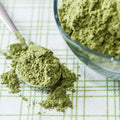 Spoonful of organic wheatgrass powder