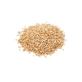 Pile of ivory-colored organic white quinoa grains on a white background