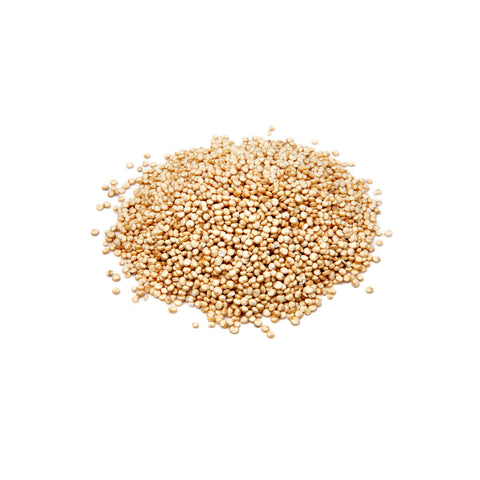 Pile of ivory-colored organic white quinoa grains on a white background