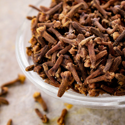 Organic whole cloves in a bowl