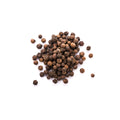 Whole organic black peppercorns on a white background