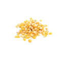 Whole dried organic yellow corn kernels on white background