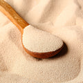 Wooden spoon filled with active dry yeast 